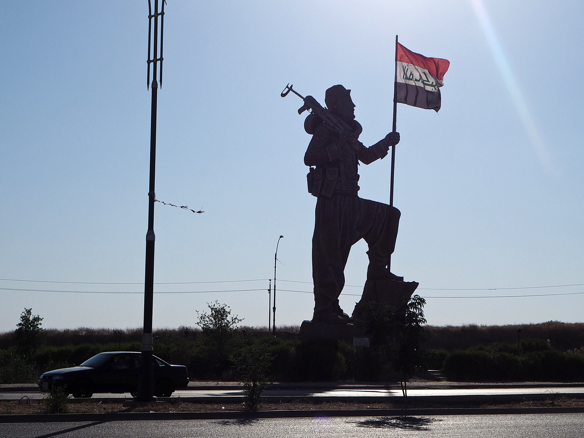 A giant Peshmerga statue on the Kirkuk-Erbil road, completed shortly before the 2017 Referendum, now flies the Iraqi, not Kurdish.