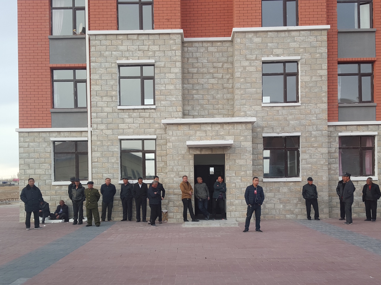 Residents of Lu Jia outside their new apartments 20 years after they were relocated from disaster-prone areas