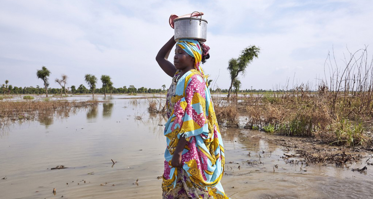 A woman walks through floodwaters in Maban, South Sudan, where large areas have been inundated by heavy rains in recent months.