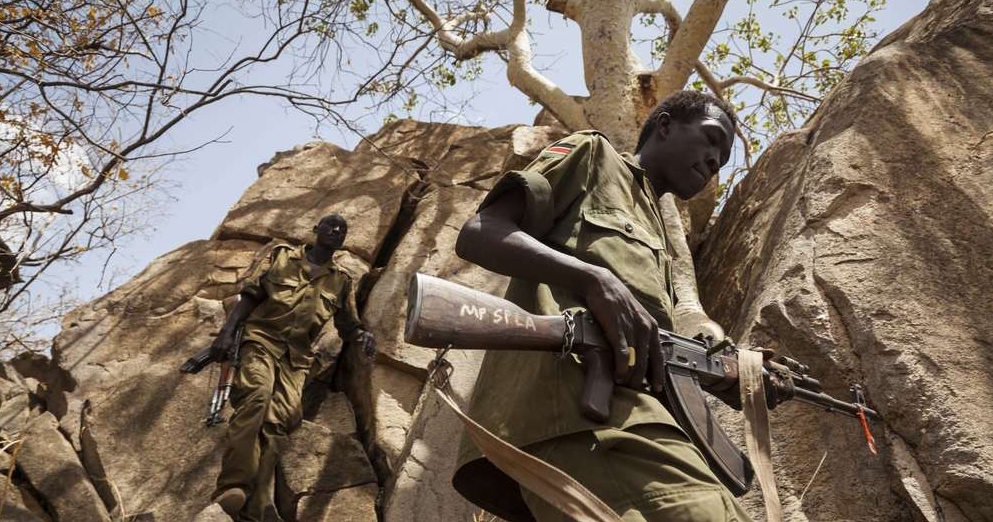 Soldiers from the Sudan People’s Liberation Army – North (SPLA-N), climb through the mountains of South Kordofan, Sudan, April 25, 2012.