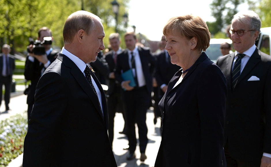 Vladimir Putin and Angela Merkel