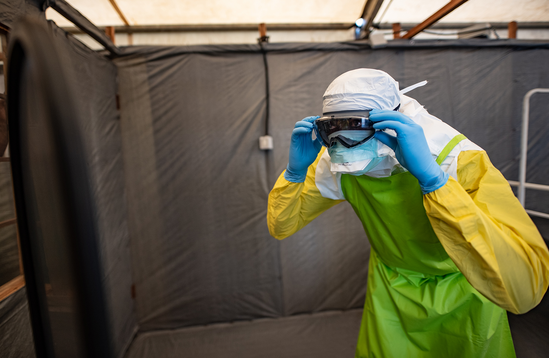 A photo of a man with protective gear in an Ebola centre
