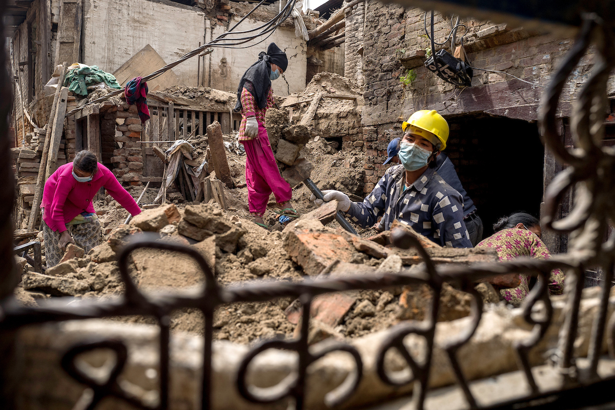 Labourers clear debris from a collapsed home in Bhaktapur, Nepal.