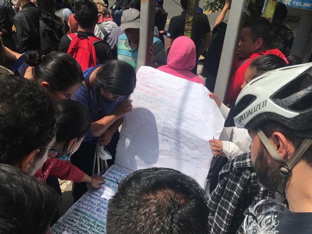 A young man tries to console a friend who was waiting for news of a relative trapped in a collapsed office building after the earthquake in Mexico City.