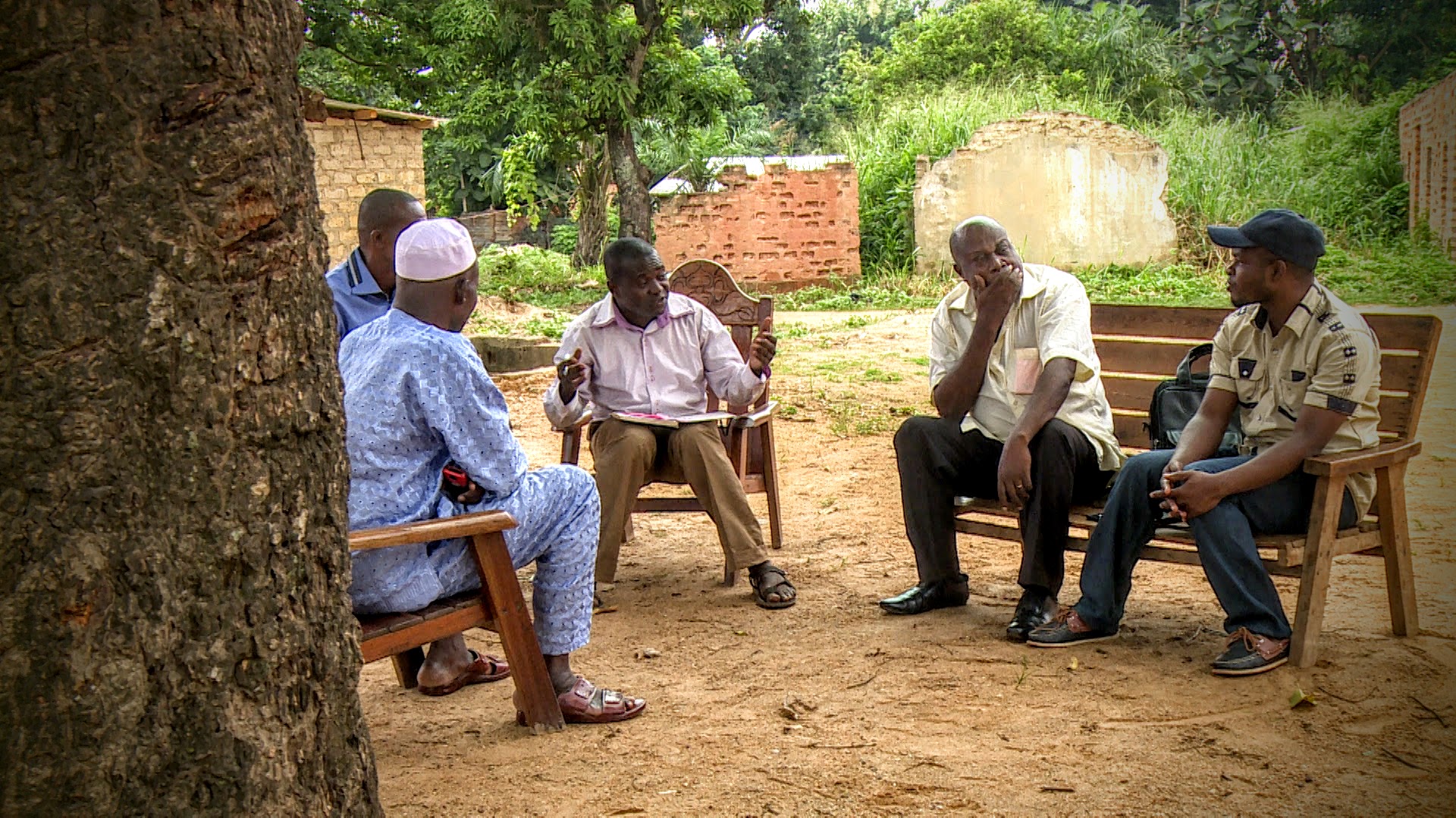 Five men gather for a peace cell meeting