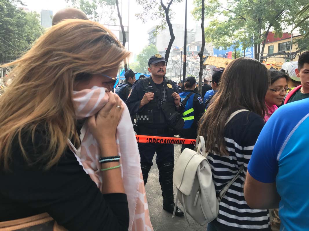 Family members of those trapped in the office building waited for news of their loved ones. Police created a security perimeter around the building