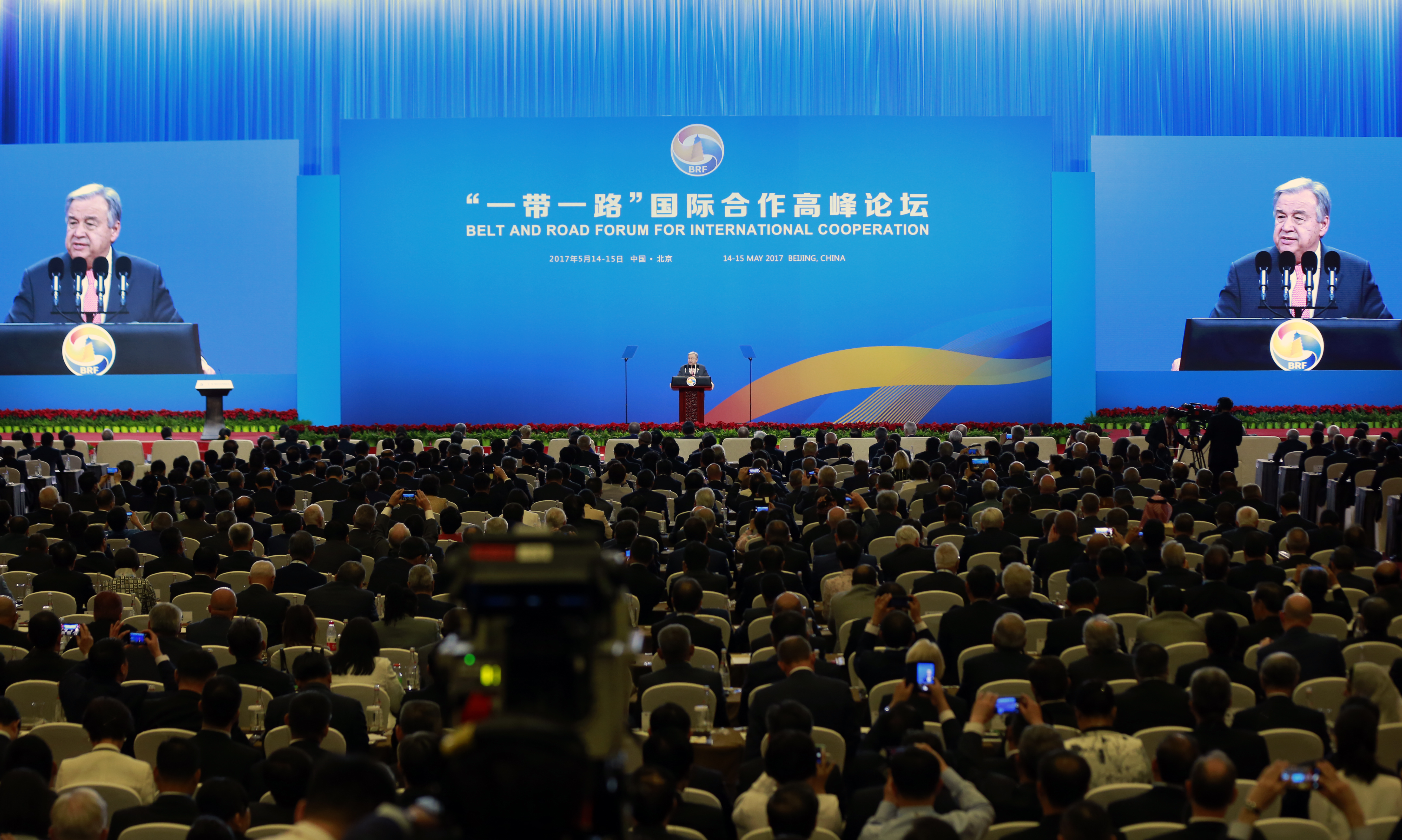 Man speaking at conference.
