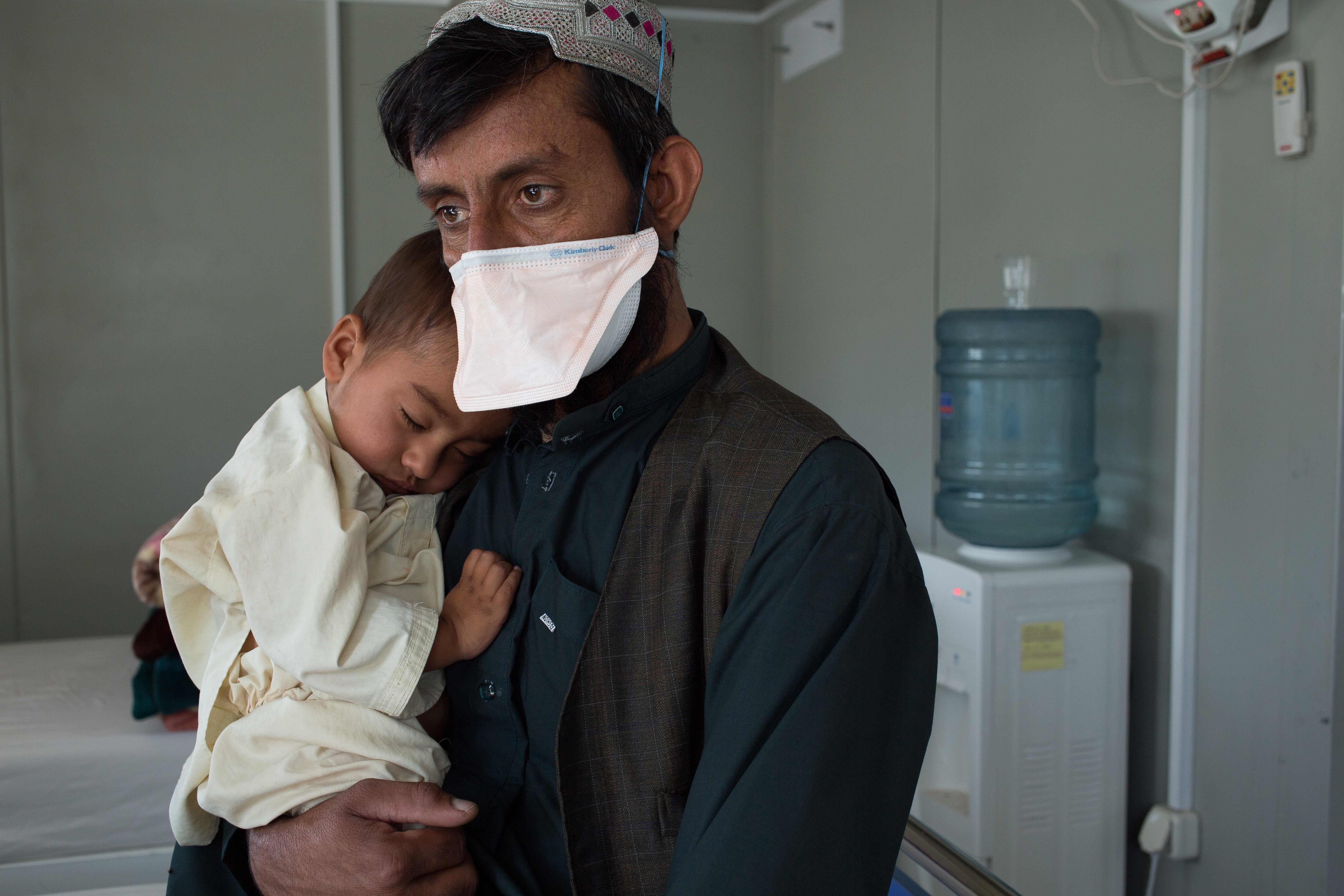 A boy and his father in a hospital