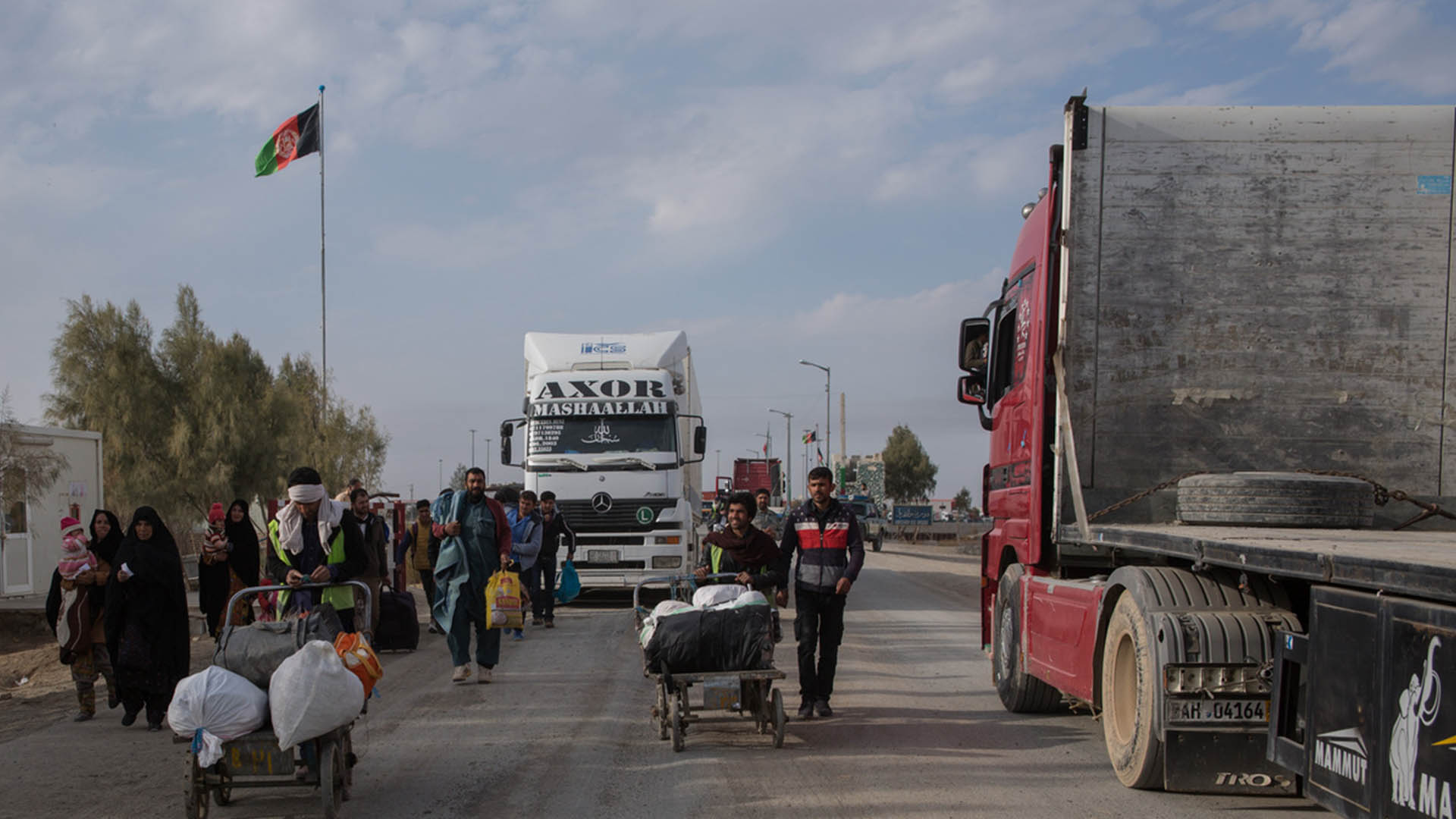 People return from Iran at a border crossing near Zaranj in Afghanistan’s Nimroz Province.