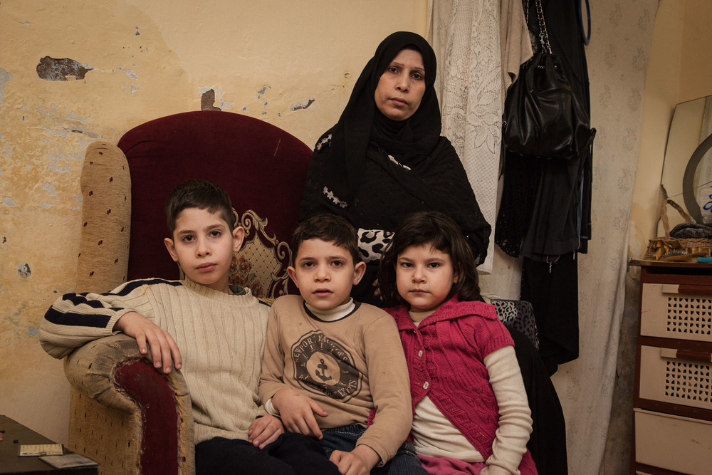 An interior photo of a woman and her three children.