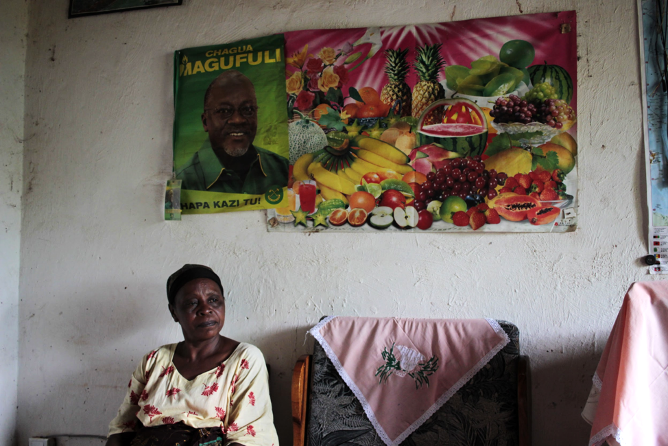 Posters of Magufuli and the ruling CCM regime adorn Magreth Mtema’s living room