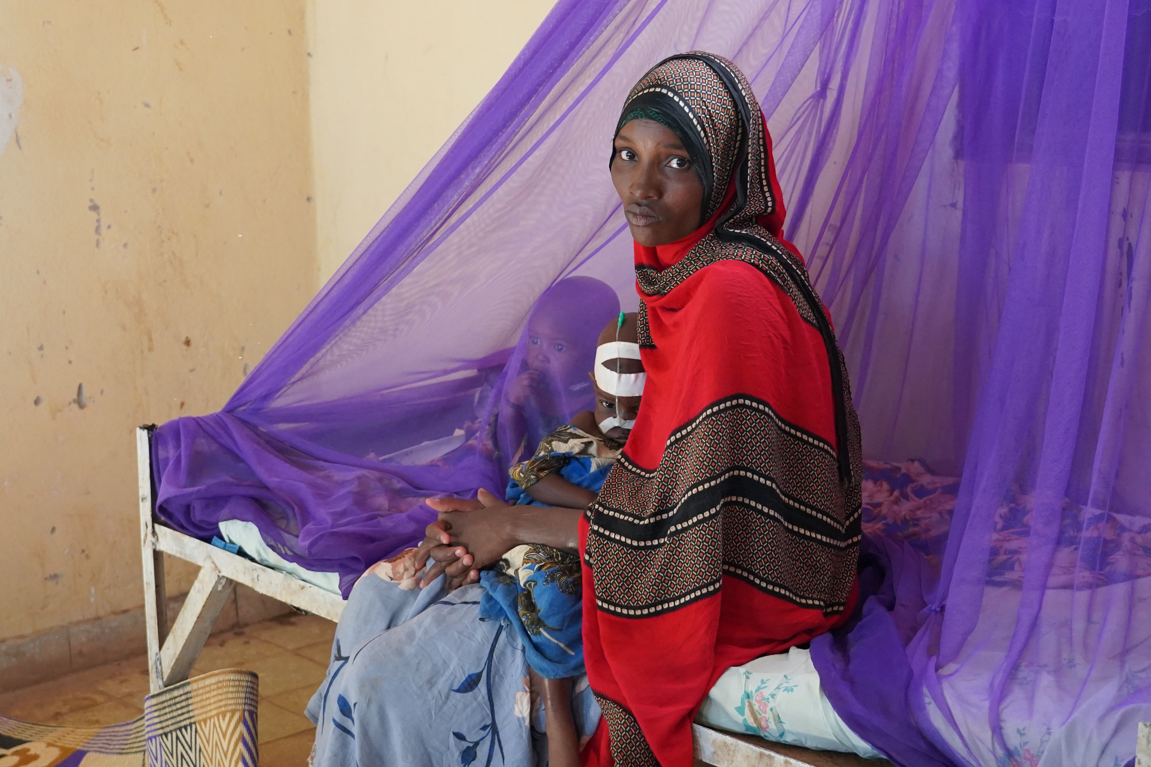 A woman and her children sit on a bed at a hospital in Ethiopia's Somali region. Rates of severe acute malnutrition among children have risen sharply in drought-affected regions.