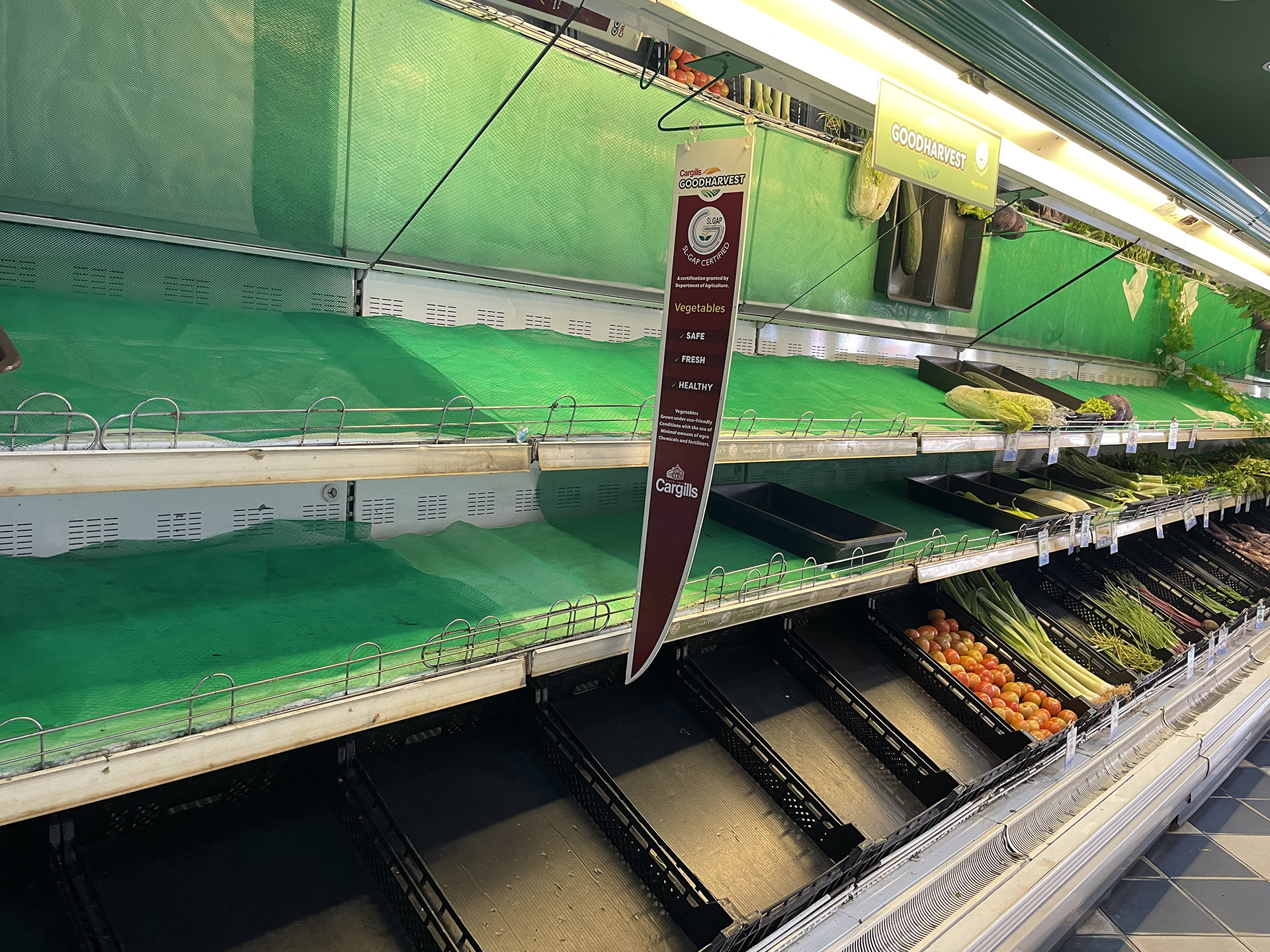 An empty supermarket shelf in Matara. Fuel shortages and soaring food prices have led to scarcity.