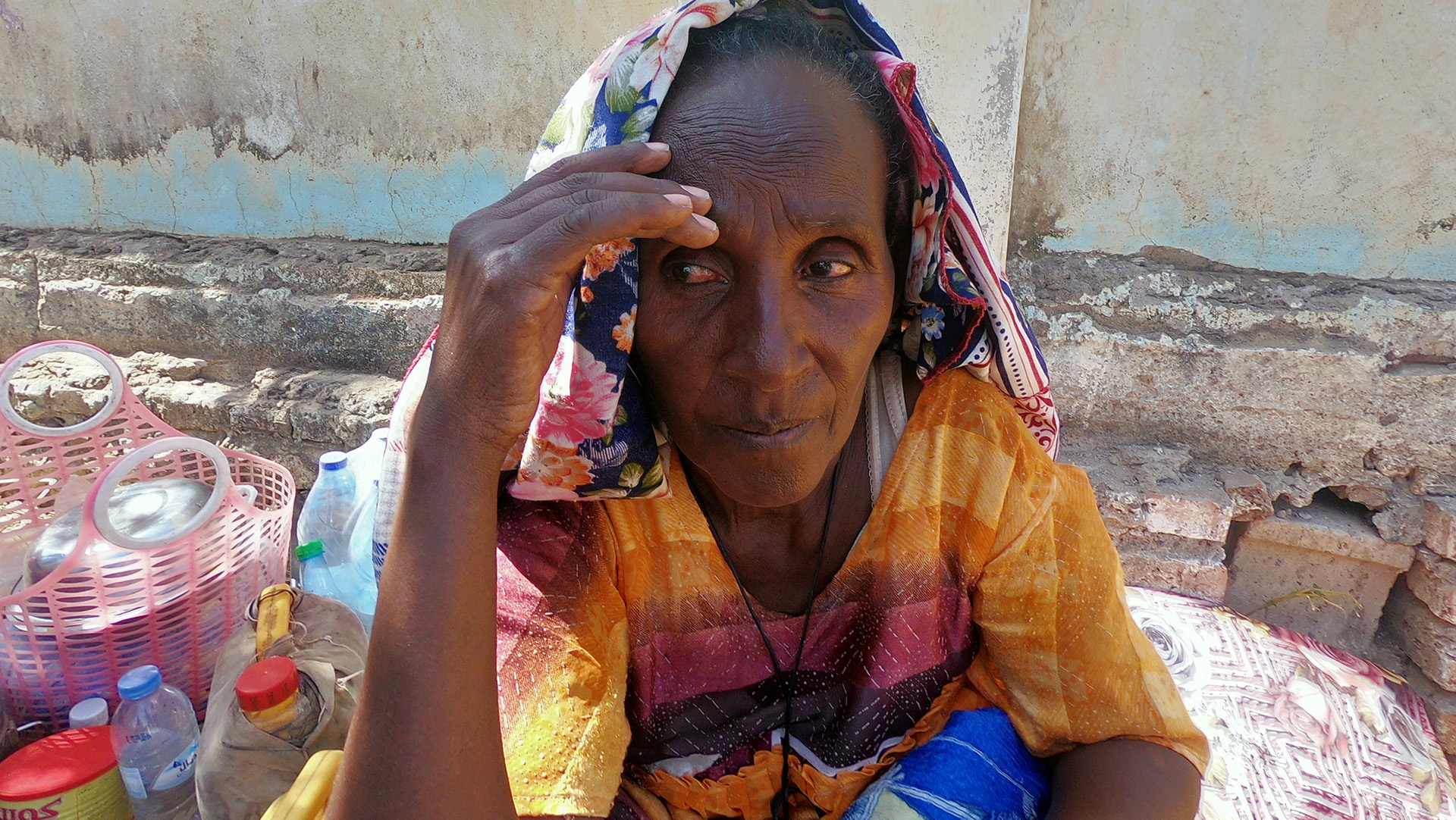 An Ethiopian woman who fled the ongoing fighting in Tigray region arrives in Hamdayet, a Sudanese border town. Almost 40,000 people have crossed the border seeking safety over the past two weeks