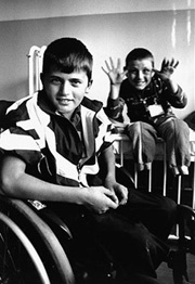 Cousins Altin, aged 9, and Adem, 13, were playing in a field when one of them tripped a trip-wire activated fragmentation mine. They each lost both of their legs. Kosovo, July 1999.