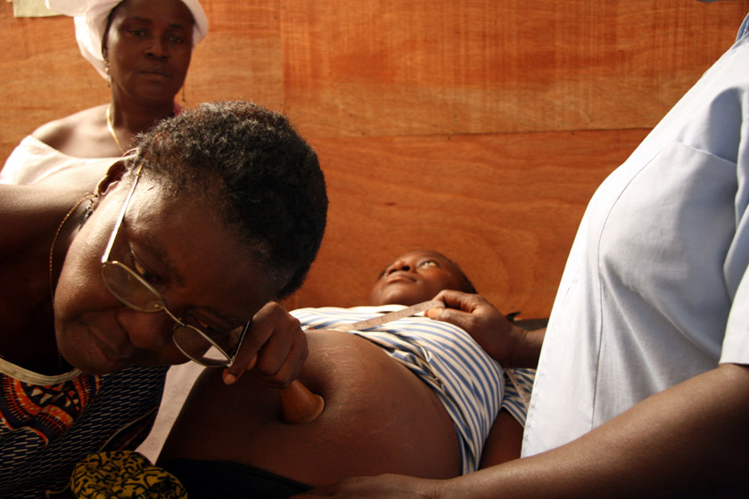 A heavily pregnant woman is given a routine check-up at a donor-funded health clinic in Monrovia on 20 February 2007. The health system has been devastated by more than a decade-long civil war. According to the World Health Organization, the average life