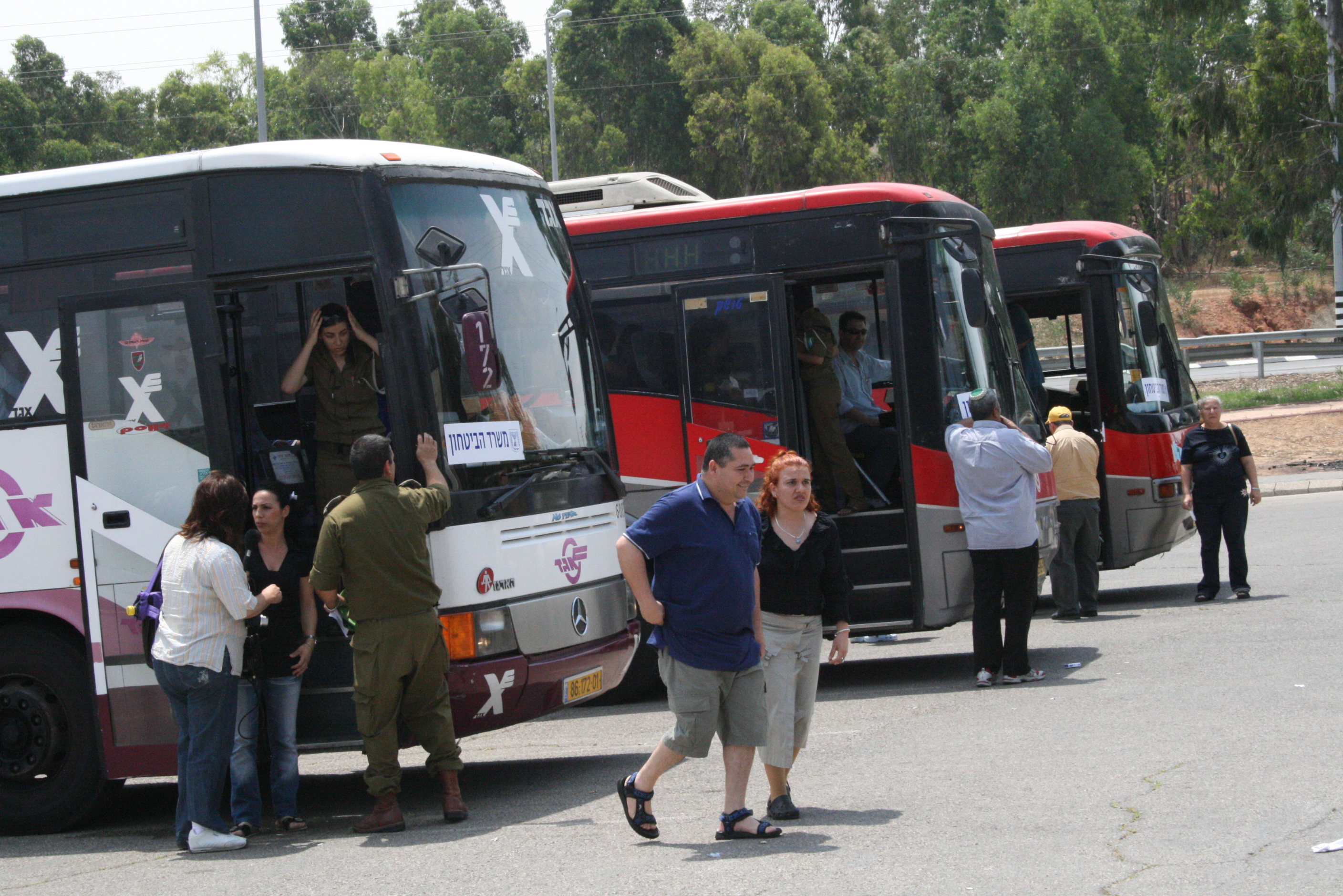 Buses organised by Israel's Ministry of Defence to evacuate residents from Sderot, scene of intense rocket fire from the Gaza Strip ,Sderot, OPT/ Israel, May 2007.