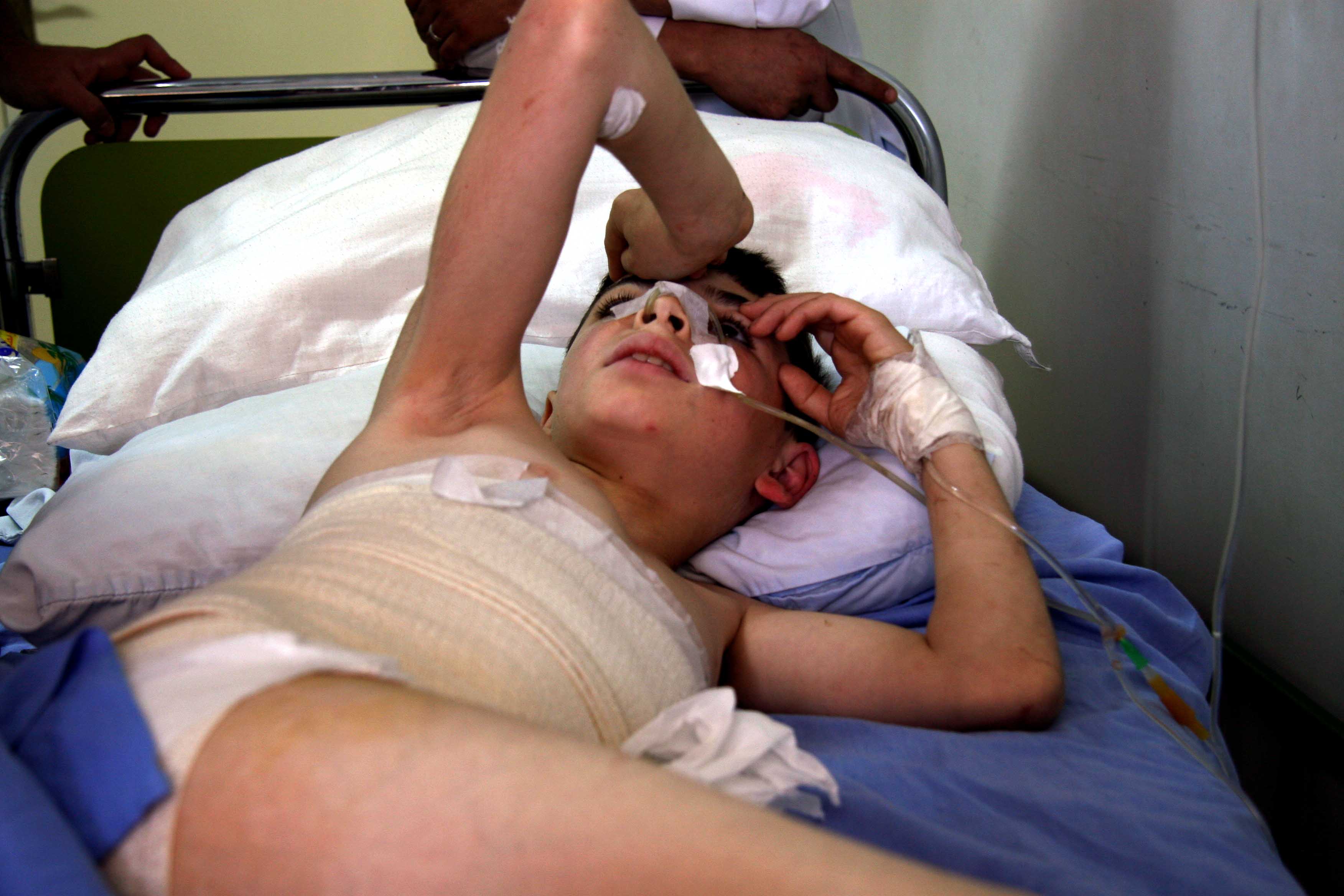 Yousef Abu Radi, 12, was hit by shrapnel when a civilian bus fleeing Nahr al-Bared came under fire. His mother died in the incident.