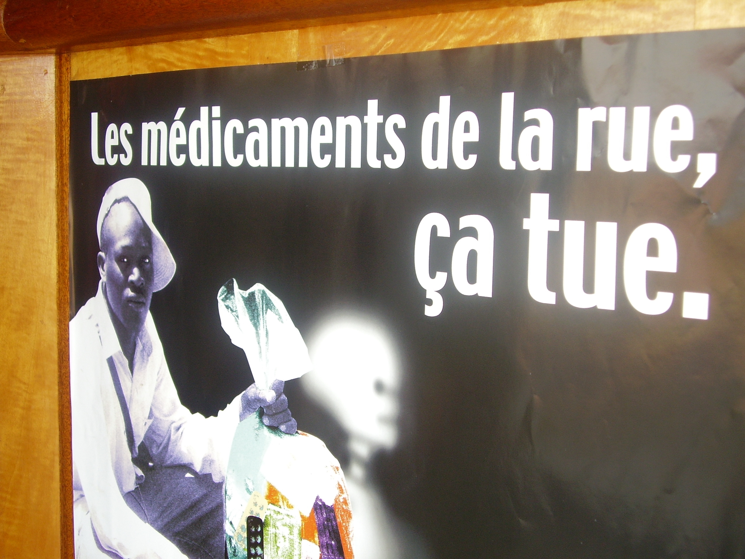 Poster in campaign against fake drugs, trafficked prescription medicines, Abidjan, Cote d'Ivoire ('Street medicines kill').
