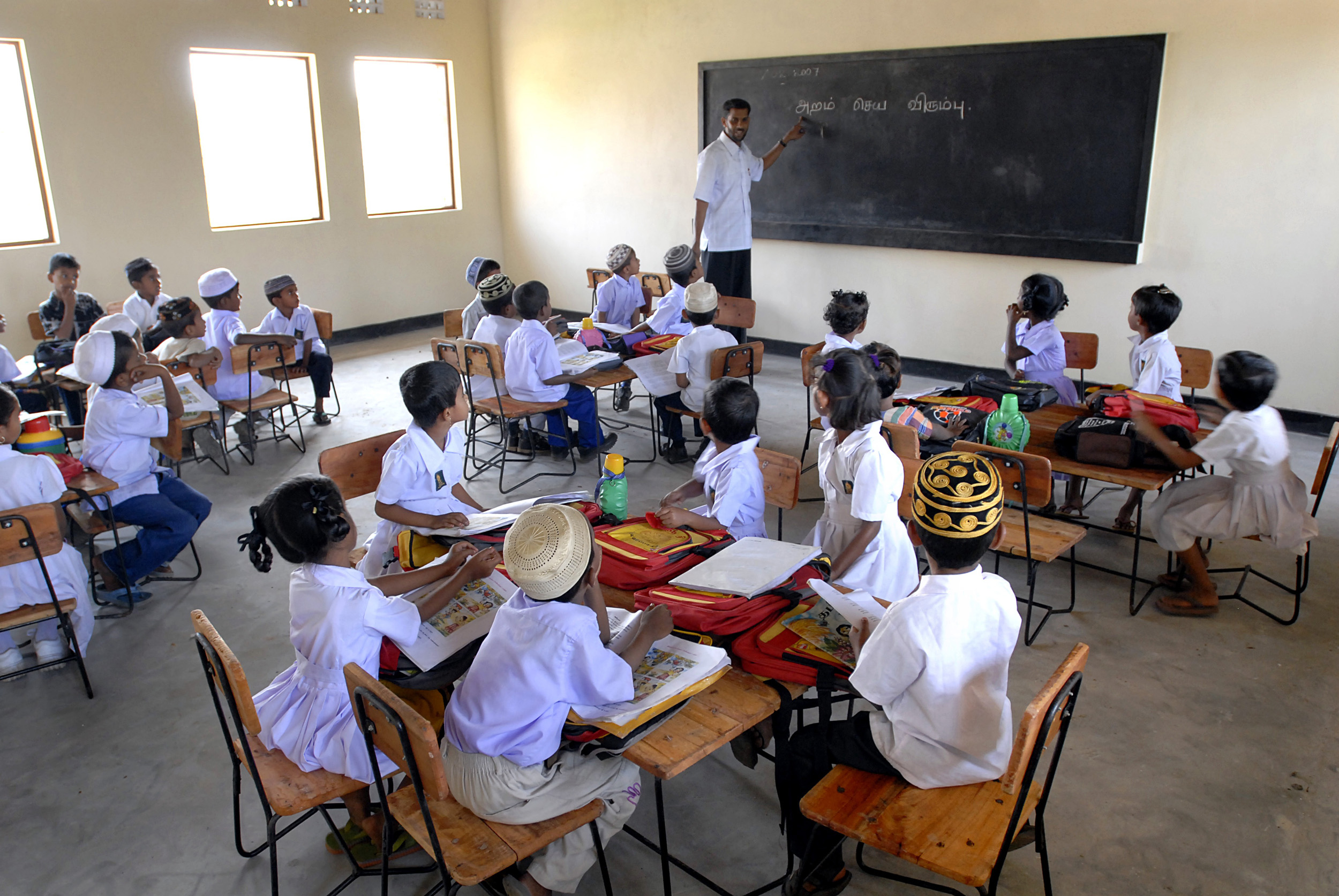 School children in a school reconstructed by the Norwegian Refugee Council (NRC) in Batticaloa District in eastern Sri Lanka. The NRC has committed to reconstruct 24 tsunami-damaged schools nationwide and has thus far completed work on 22.