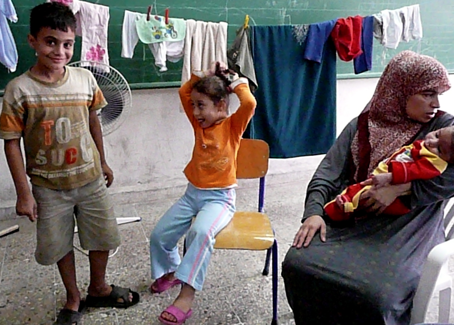 Souad al-Sayyed still lives in a classroom with her four-month-old baby, born after she left her home in Nahr al-Bared five months ago.
