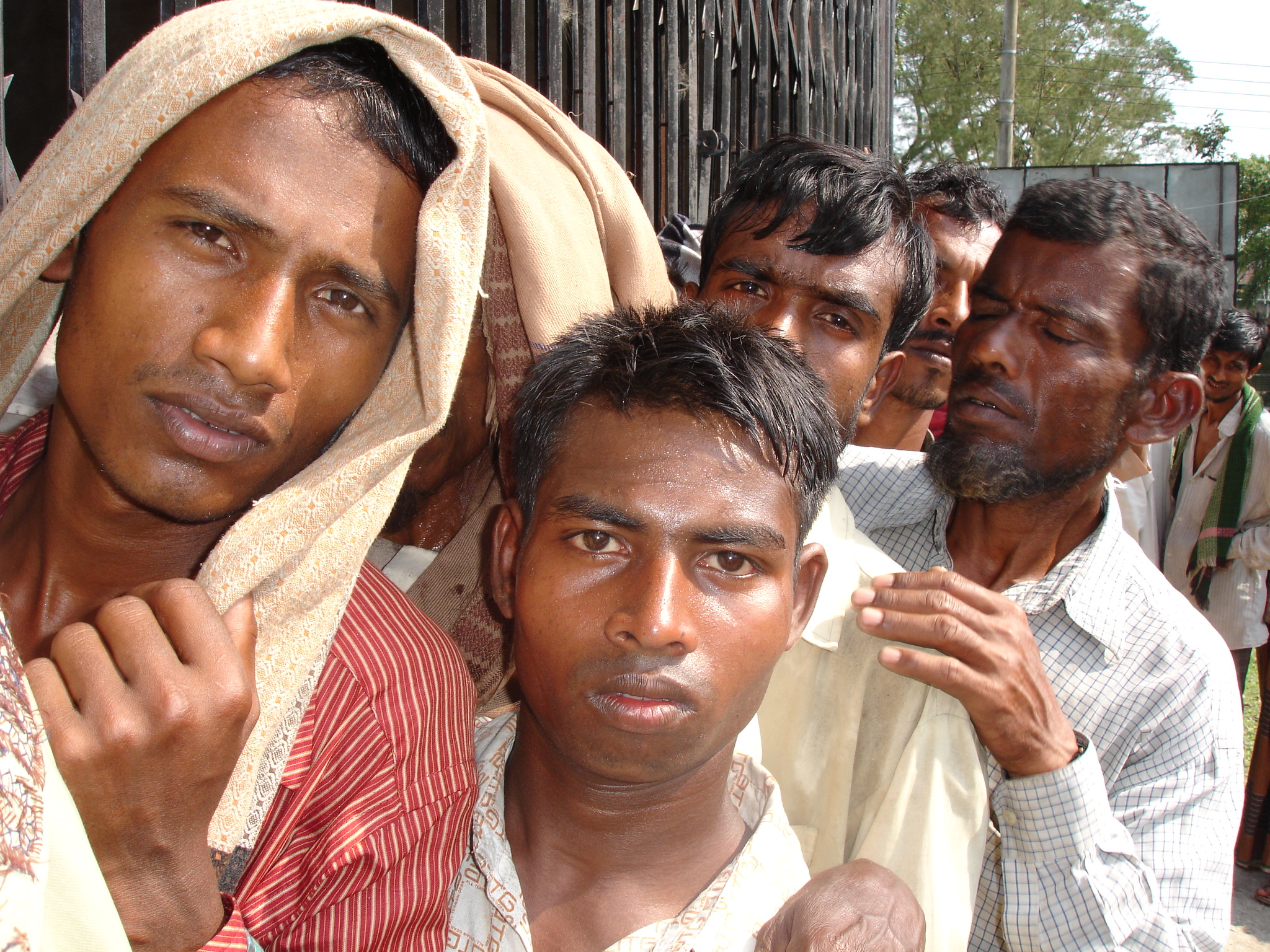 Men queue up for much needed government relief in Patuakhali District, southern Bangladesh, in the wake of Cyclone Sidr on 15 November. More than 3,000 people were killed when the category four storm struck the country's coastal belt.