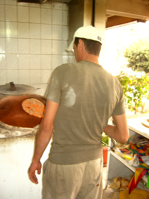 An Iraqi working illegally in a bakery in Cairo. Some Iraqis are returning home because of lack of funds.