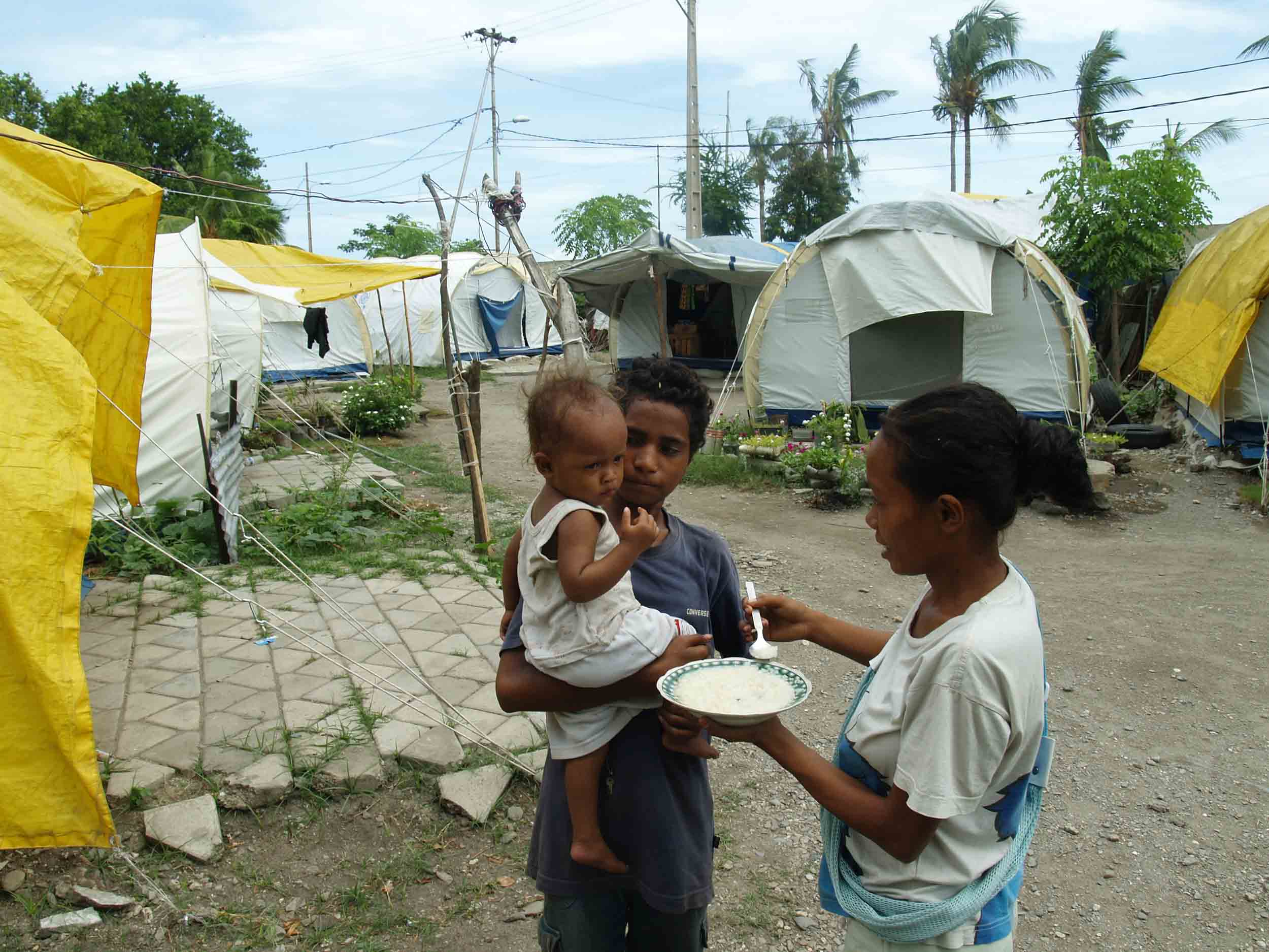Feeding time at Motael IDP camp in Dili. A recent WFP Dili emergency food security study found 25,000 people at “risk to lives” and needing immediate assistance and 40,000 at “risk to livelihoods”.