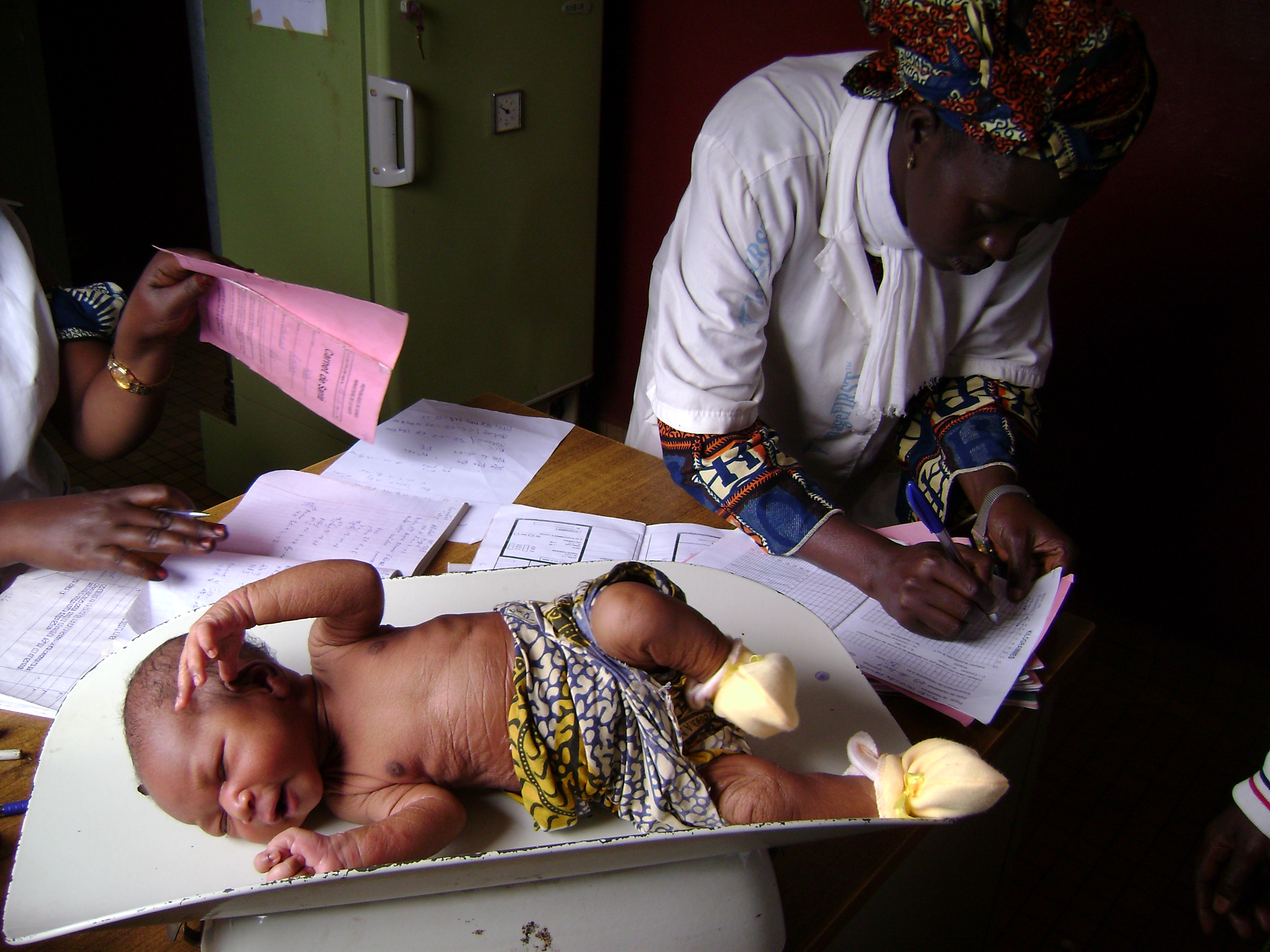 Baby-weighing at a health clinic in Labe, Guinea. October 2007.
