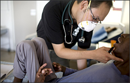 A doctor at Basabelo TB Hospital in Maseru, Lesotho, examines a patient with MDR-TB