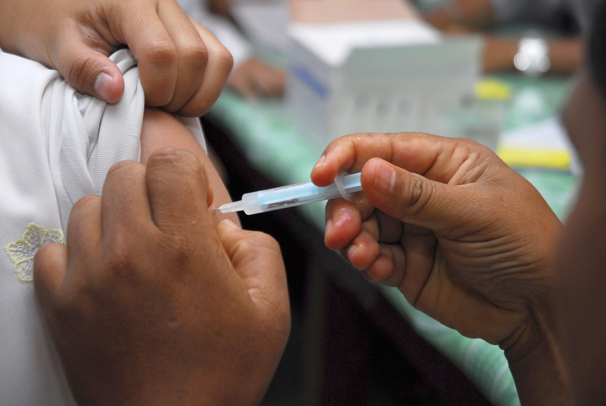 A student receives tetanus vaccination during UNICEF tetanus vaccine campaign to the students of Senior High School SMAN 1 Kepahiang, Kepahiang district, Bengkulu province, Indonesia on November 21, 2008