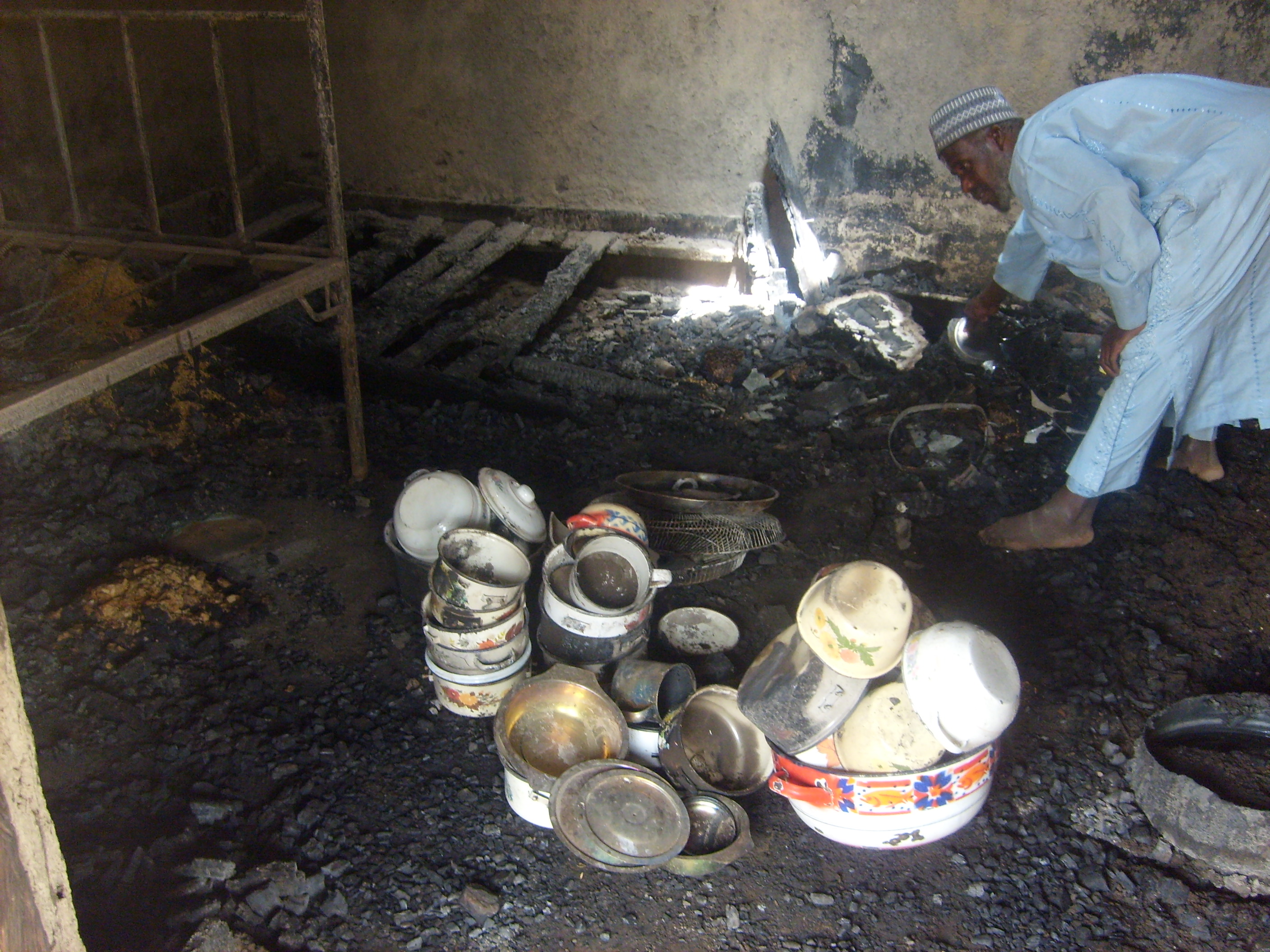 Recurring violence: a man examines his burnt-down house following clashes in Bauchi state, February 2009