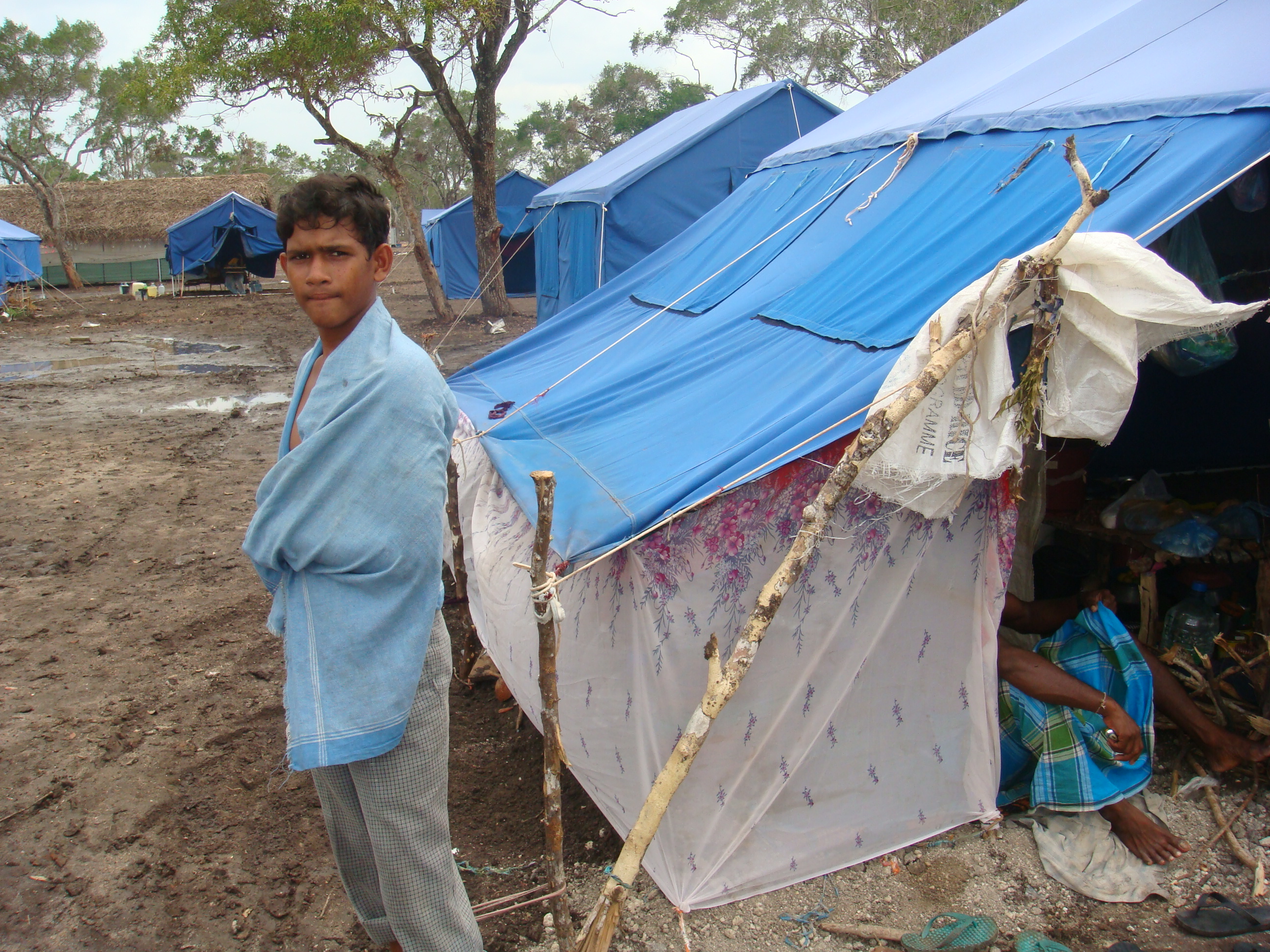 A scene inside the Menik Farm camp outside Vavuniya following heavy rains on 17 August 2009. Menik Farms is the largest of 14 camps in the district, with more than 208,000 residents
