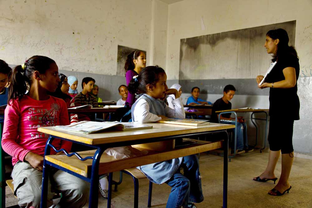 With Lebanon’s chronic power shortages, classes at the Rajam Issa public school in the remote northeast of Akkar are often plunged into darkness during the winter