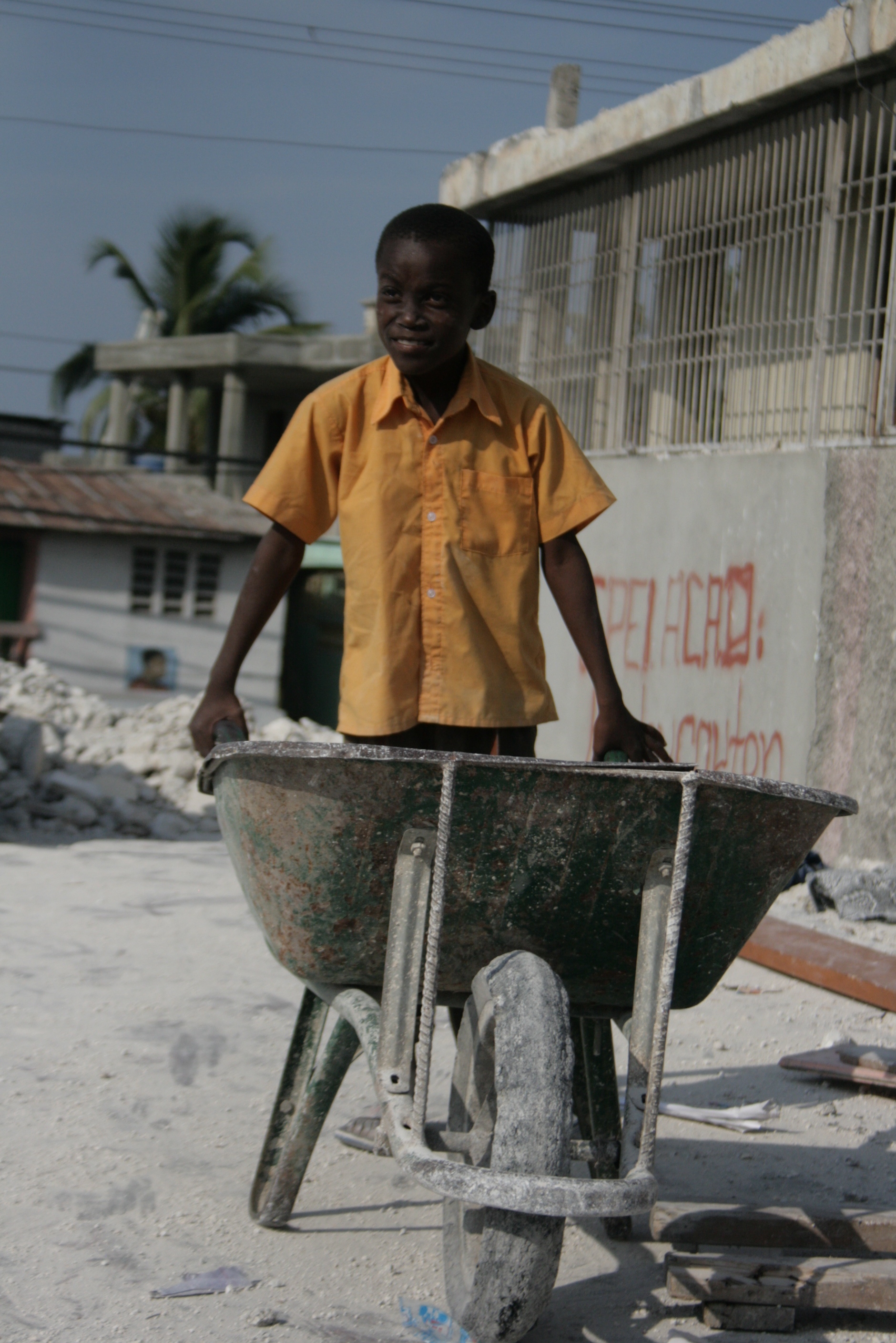 Boy takes part in cleaning up earthquake rubble at a church/school building in the Martissant neighbourhood of Port-au-Prince. March 2010