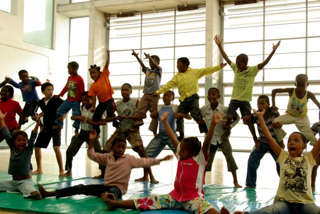 Children from the Cirque du Monde Ibhongolwethu Project in Khayelitsha rehearse their moves