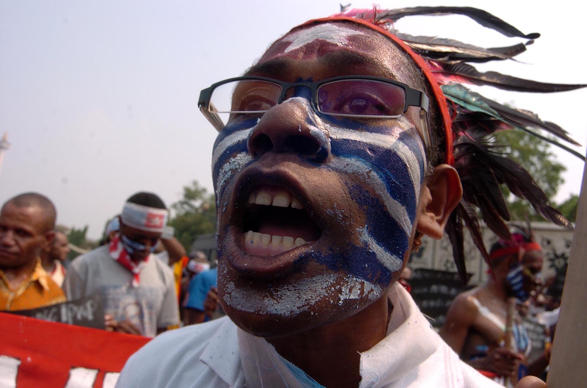 A Papuan woman demonstrates for greater autonomy in Jakarta. Local anger about inward migration continues, and there is a risk of a rekindling of separatist violence in Indonesia's easternmost province