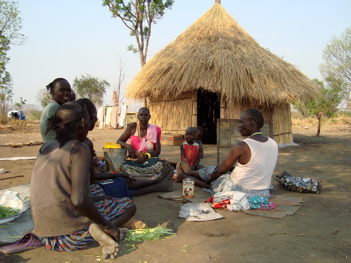Families discuss about the new plans of the Ethiopian government in Karmi village, one of the new villages formed after the villagisation program started