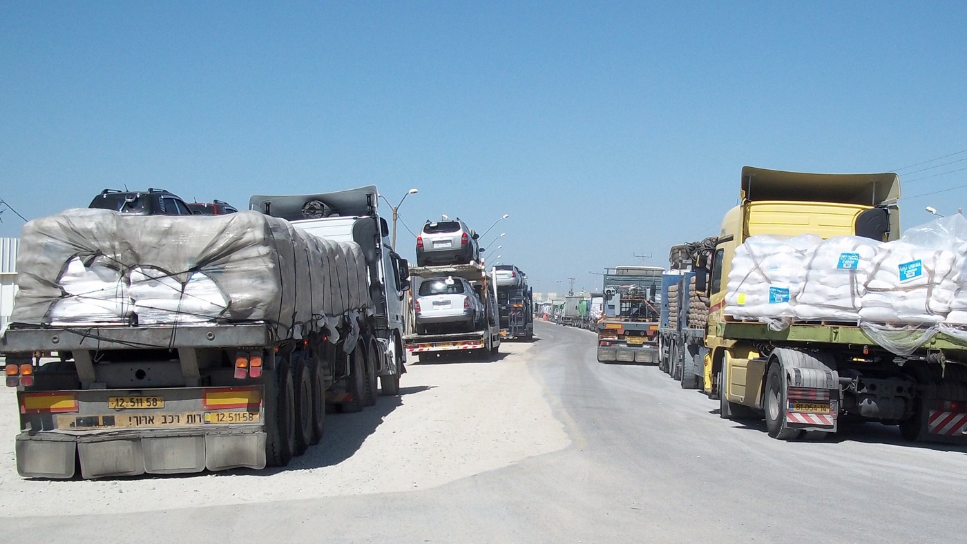 Truckloads of humanitarian aid and commercial goods bottle-necked at at Kerem Shalom crossing along the Gaza-Israel border