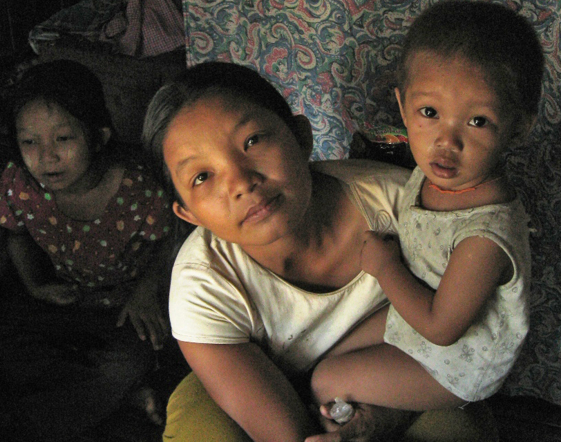 The wife of a fisherman, this woman is still awaiting news on the fate of her husband who was lost at sea on 14 March 2011 following a storm