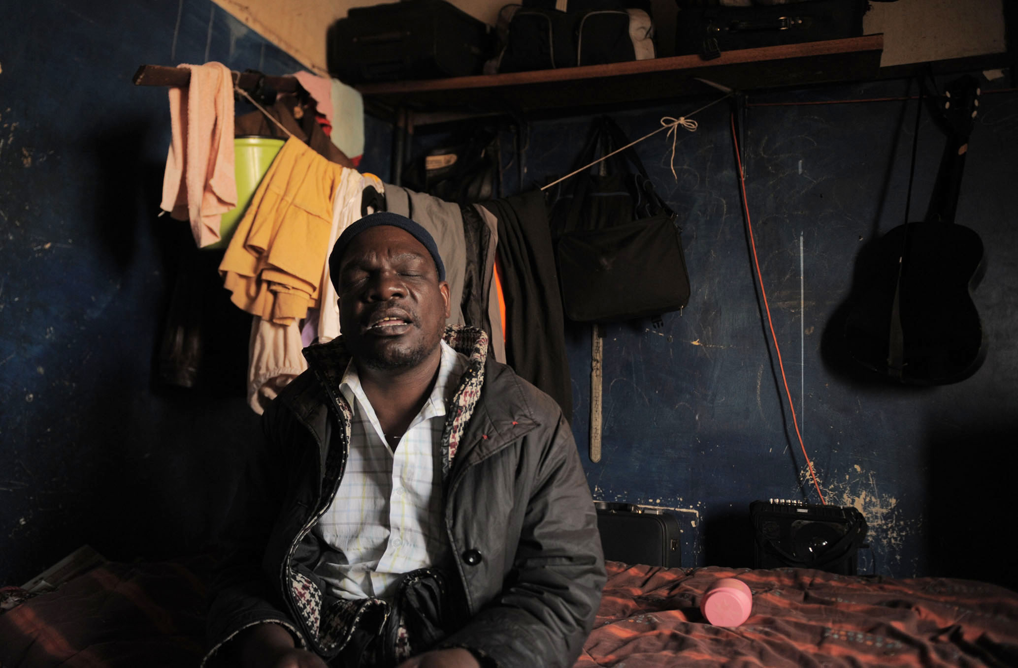 Samuel Mokwena, a blind beggar, in his room at an abandoned building in Johannesburg's inner city