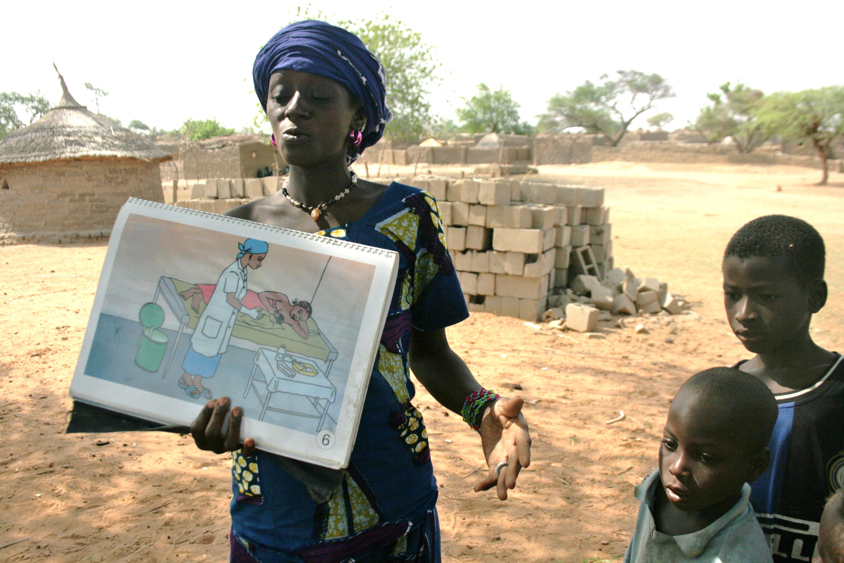 A community health worker in the village of Djomga in Dori, northeastern Burkina Faso, talks about maternal and child health and proper hygiene. June 2011