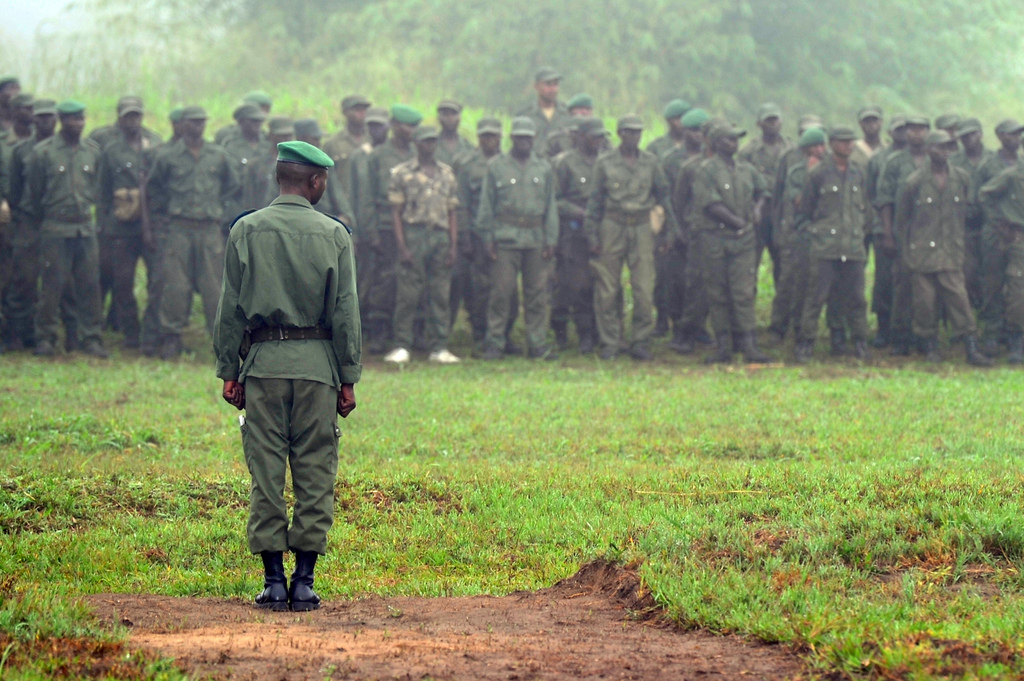 Democratic Republic of Congo Army Forces 2nd Lt. Mukamba-Mongombe, Congolese Light Infantry Battalion duty officer, addresses the battalion in preparation for the flag ceremony on Camp Base, Kisingani, DRC