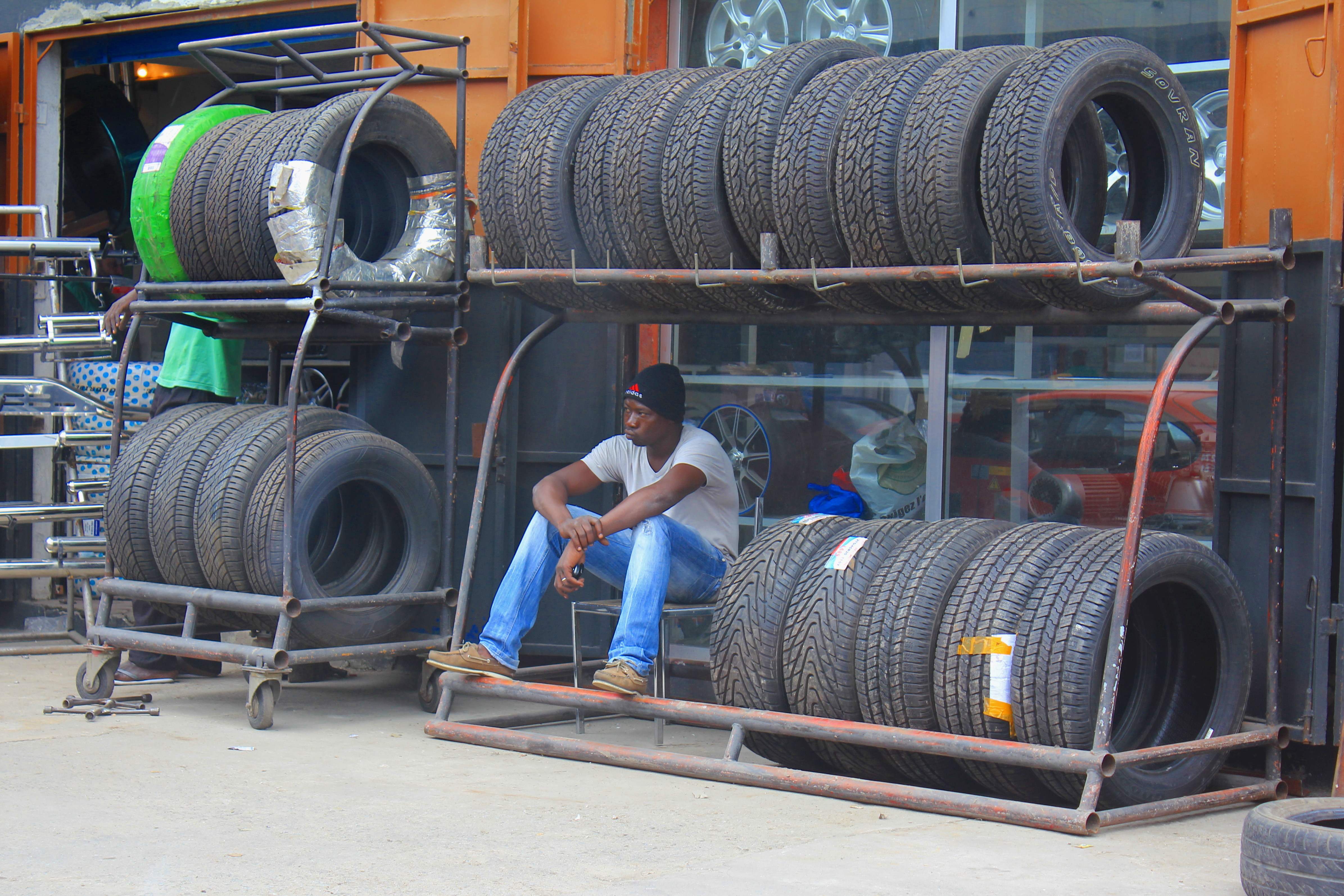 A young mechanic waits for clients in Abidjan