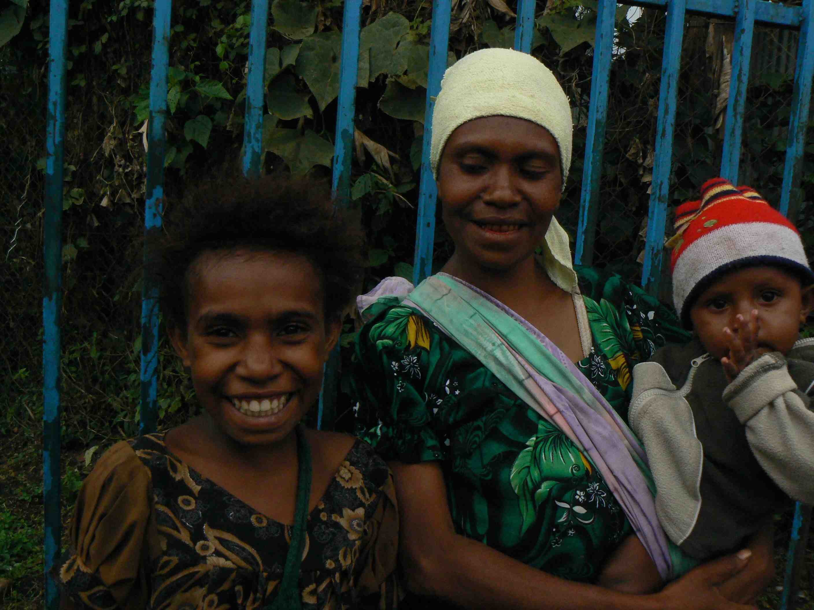 PNG's maternal mortality rate has stayed persistently high in part due to early pregnancies. Lisa Micheals, 27, is pictured with two of her five children she started having at age 16. She decided to have a tubal ligation after her most recent one after wa