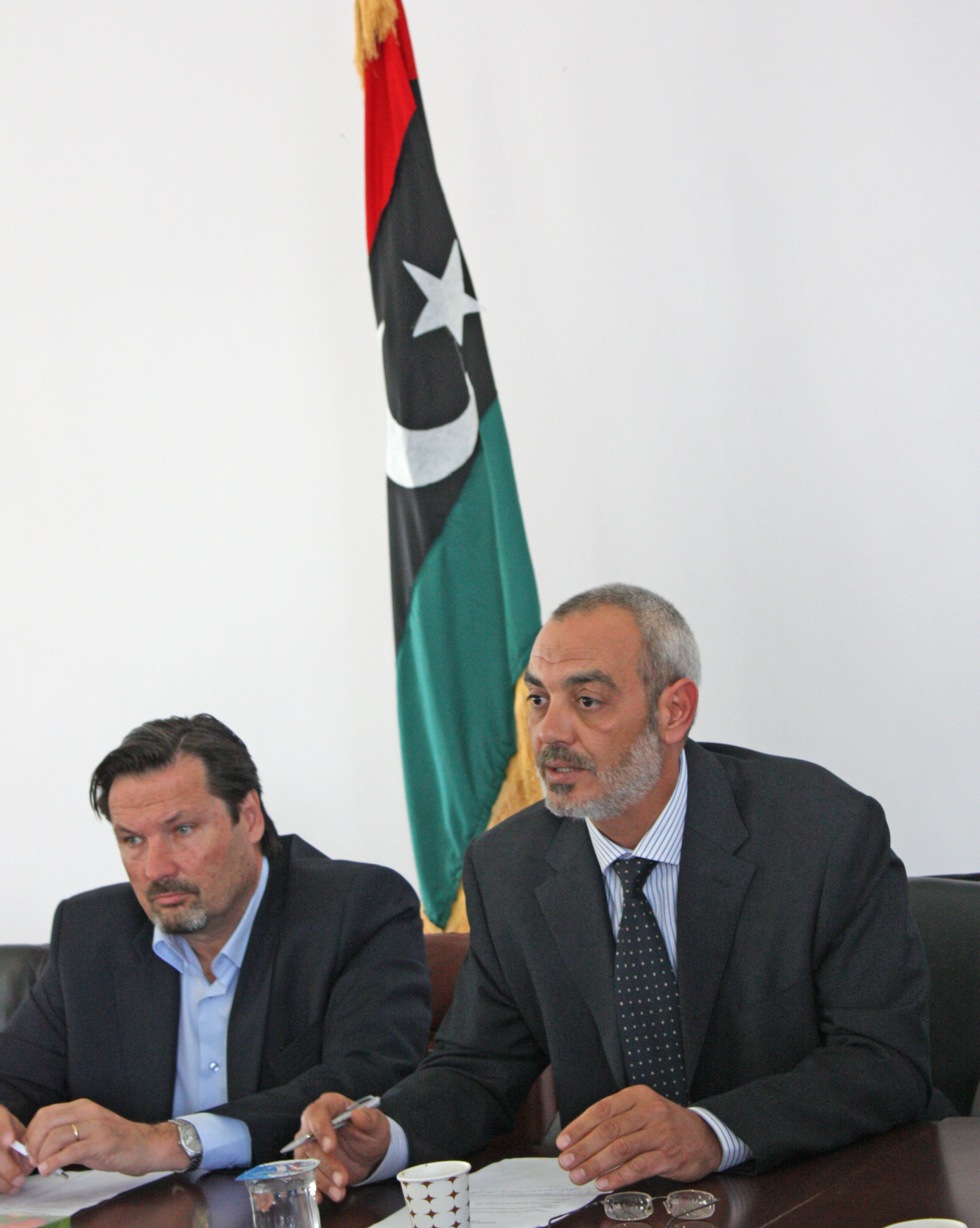 Georg Charpentier, left, the UN Resident/Humanitarian Coordinator and Deputy Special Representative of the Secretary General in Libya, sits next to Khaled Ben-Ali, head of the Libyan Humanitarian Relief Agency, or LibAid, at a joint coordination meeting i
