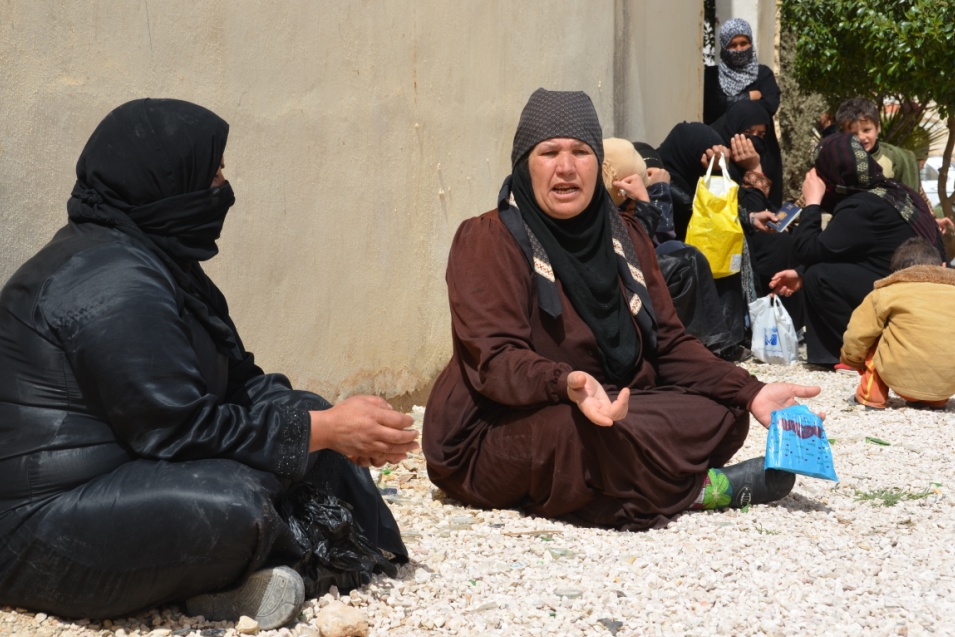 Syrians who fled to Jordan wait to register with the Jordan Red Crescent to receive assistance. Many Syrian refugees arrive with very little savings and need food and non-food items, as well as cash to rent apartments