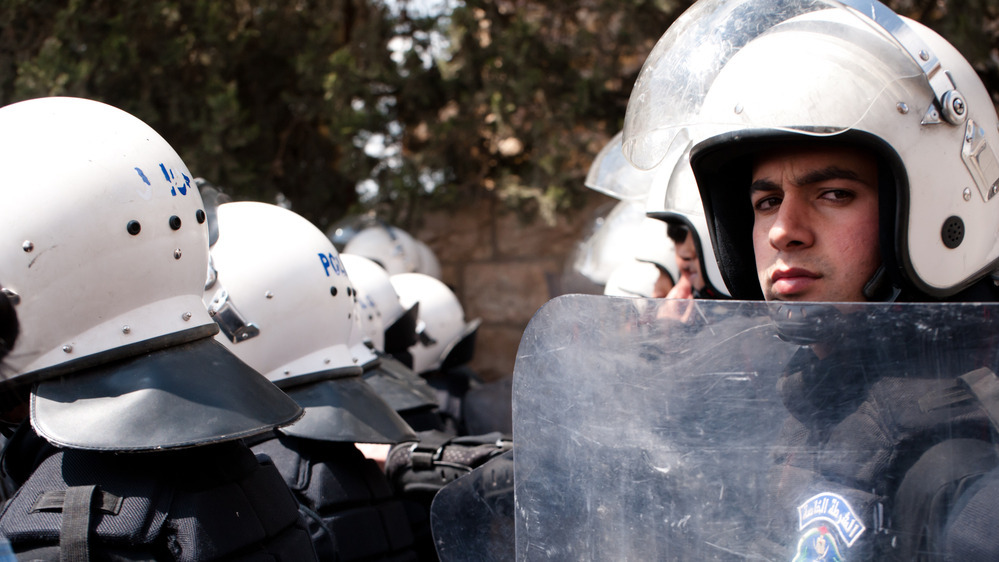 Riot police of the Palestinian Authority block access to the Bethlehem checkpoint during Land Day demonstrations on March 30, 2012