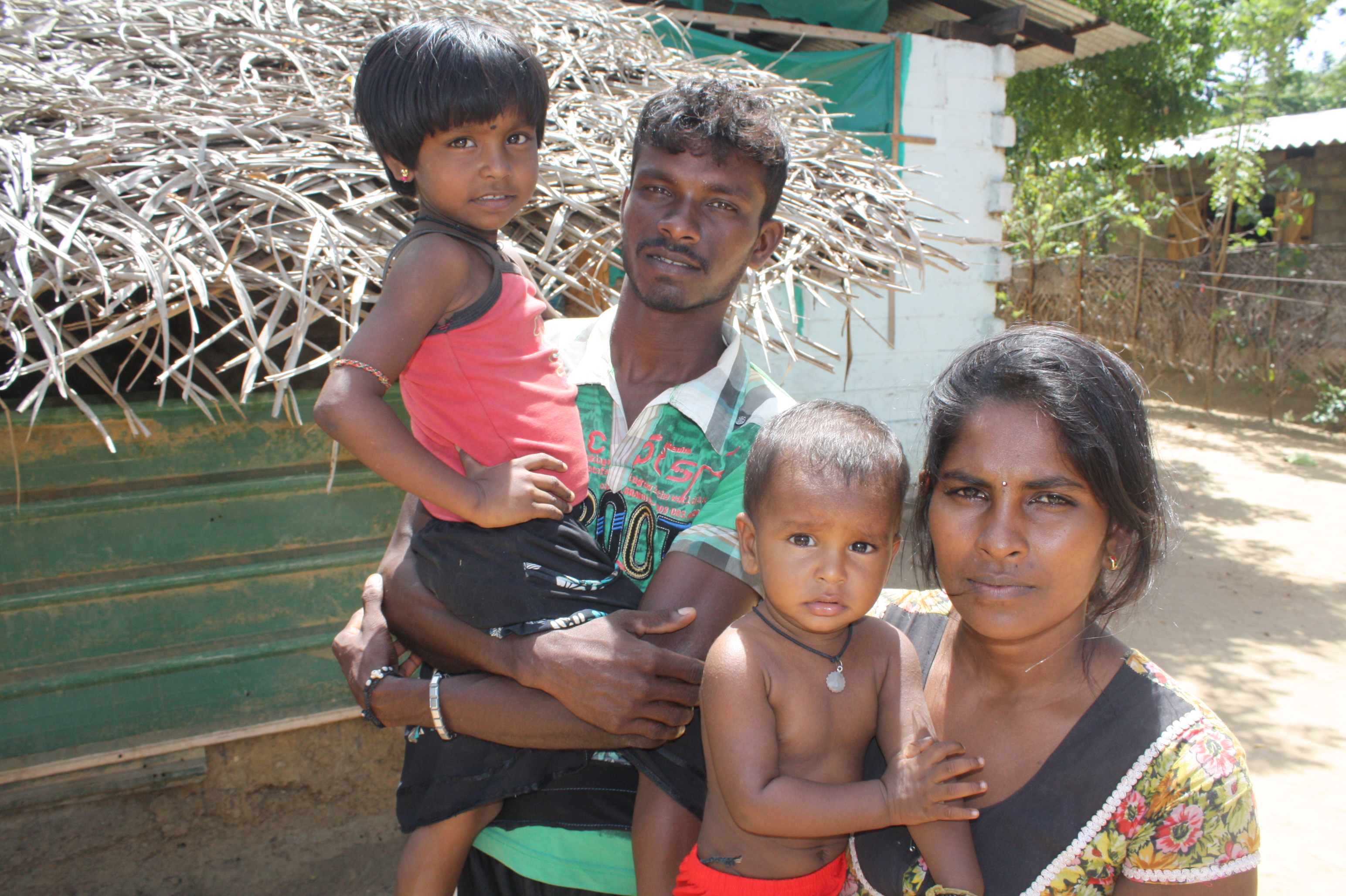 Muthulingam Thusanandam, 28, has recently returned to the the village of Vivegananthanagar outside Kilinochchi, with his wife and two young children. Displaced in 2009, he inow struggles to reestablish his life. Hundreds of thousands of displaced have ret