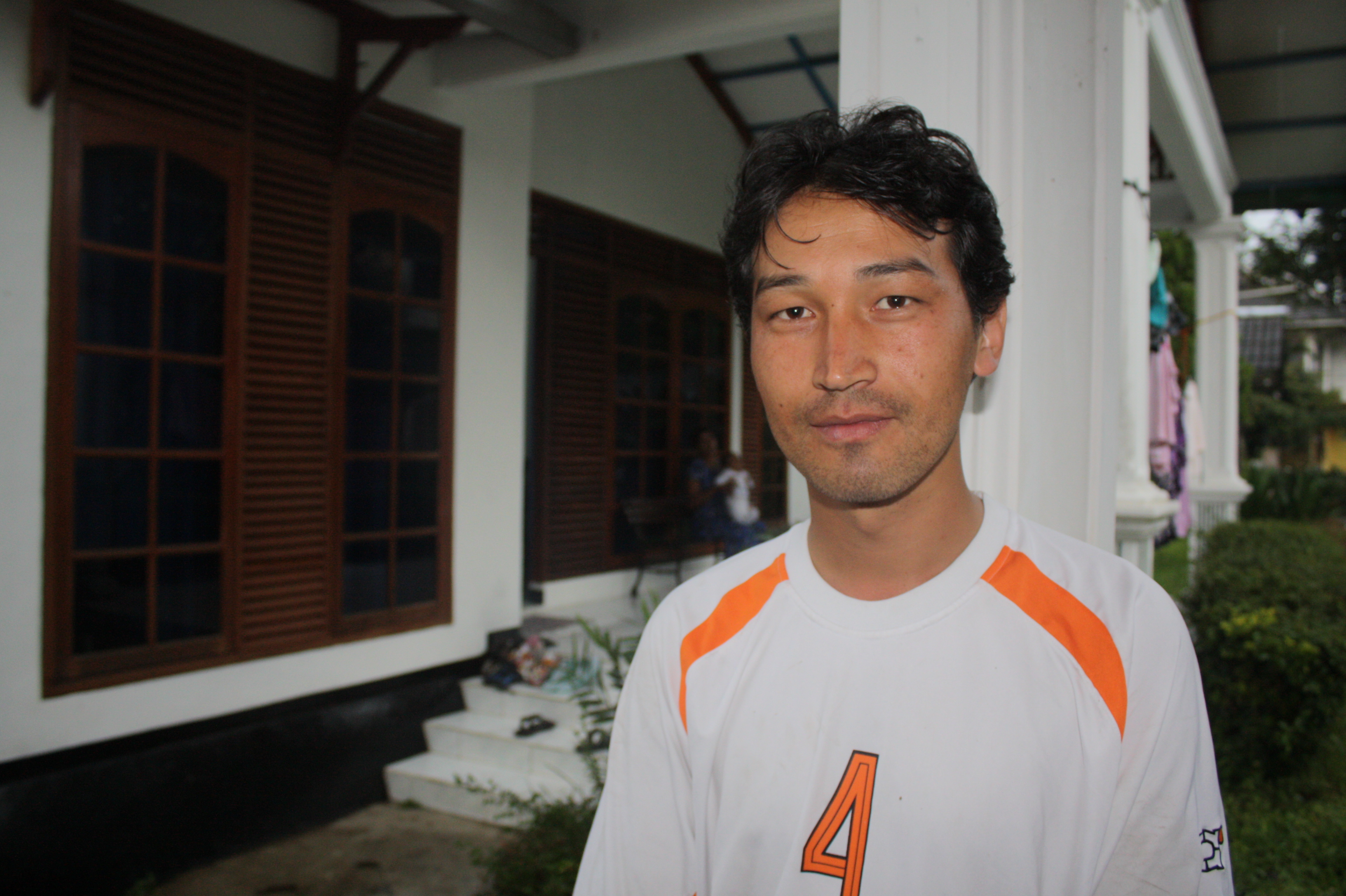 An ethnic Hazara refugee looks to the camera at a community housing centre in in the town of Pucak, a hub for asylum seekers and their families - and the people smugglers ready to assist them - about 80km outside of Jakarta